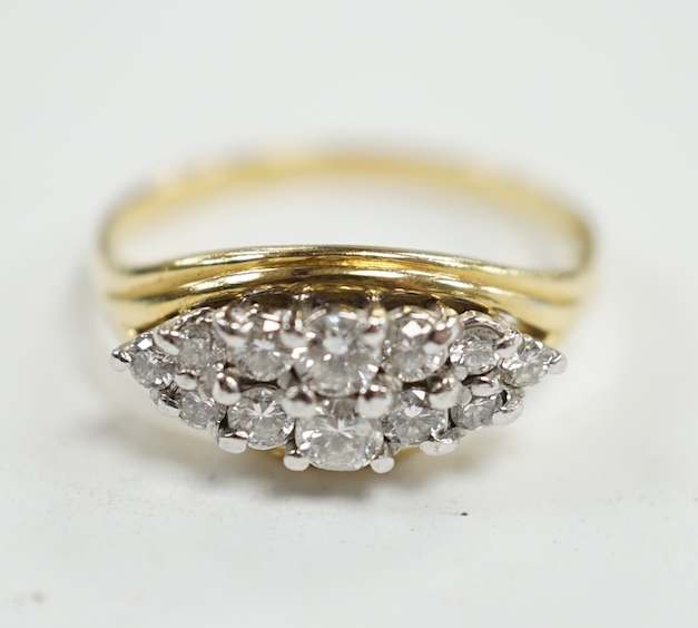 A modern 18ct gold and navette shaped diamond cluster set ring, size Q, gross weight 4.4 grams. Condition - fair